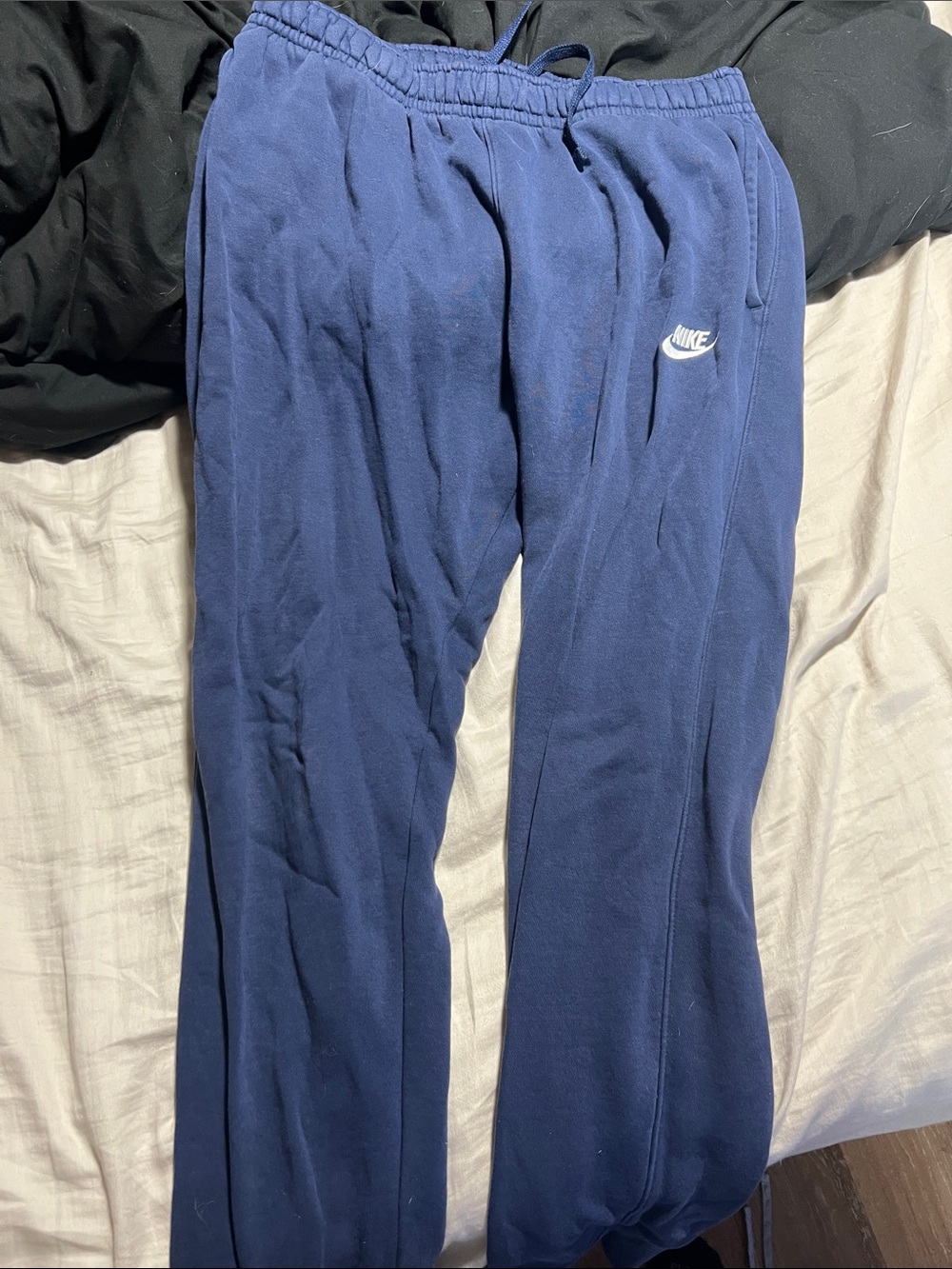 Nike men’s Navy Sweatpants with White Swoosh